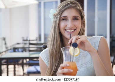 a beautiful woman drinking cocktails