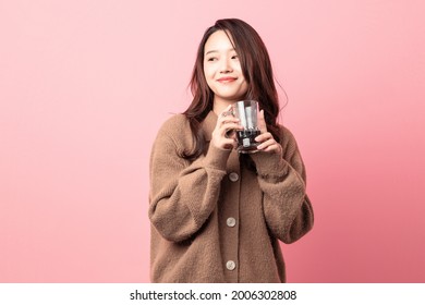 Beautiful Woman Drinking Coke On Pink Background