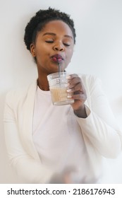 Beautiful Woman Drinking Cold Icy Coffee In Cafe From A Glass Jar. Healthy Lifestyle. Healthy Drink.