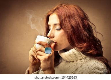 Beautiful Woman Drinking Hot Tea