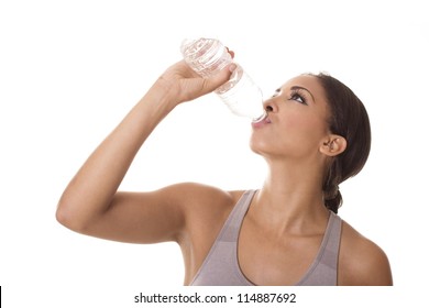 Beautiful woman drinks from a water bottle.