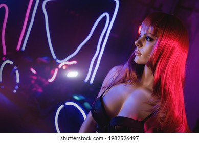 Beautiful Woman Dummy In The Neon Lights In The Motorbike Showroom.