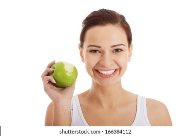 Beautiful Woman Eating An Apple. Isolated On White.