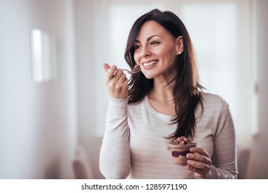 Beautiful Woman Eating Dessert.