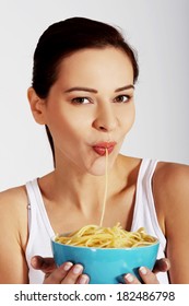 Beautiful Woman Eating Pasta From A Bowl.