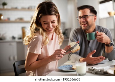 Beautiful Woman Enjoying In Breakfast With Her Boyfriend. Happy Young Couple Drinking Coffee And Eating Sandwich At Home.	