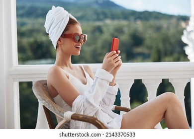 Beautiful Woman Enjoying The Morning On The Balcony Looking At The Mobile Phone Screen Mountain View