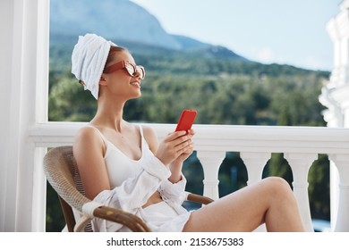 Beautiful Woman Enjoying The Morning On The Balcony Looking At The Mobile Phone Screen Mountain View