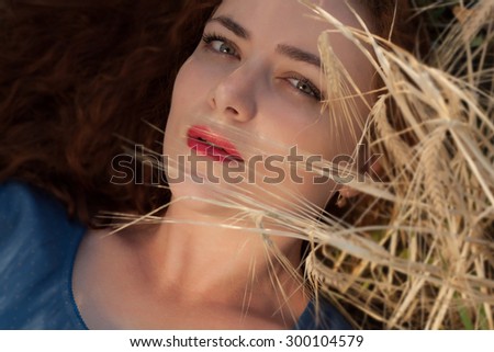 Similar – Young redhead woman covering from sun