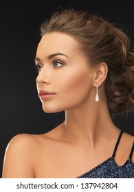 Beautiful Woman In Evening Dress Wearing Diamond Earrings