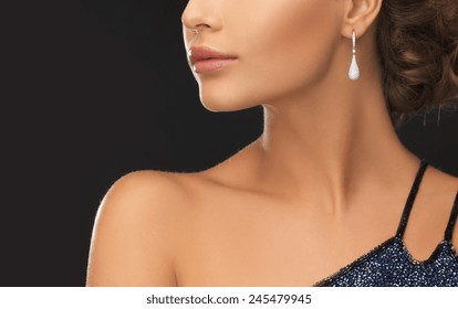 Beautiful Woman In Evening Dress Wearing Diamond Earrings