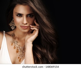 Beautiful woman with evening make-up. Jewelry and Beauty. Fashion photo