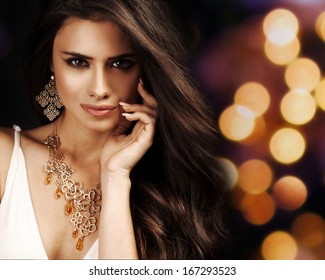 Beautiful Woman With Evening Make-up. Jewelry And Beauty. Fashion Photo