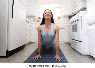 Beautiful Woman Exercising Yoga In Tiny House Kitchen, Multitasking, Fitness, Motivational Inspiration