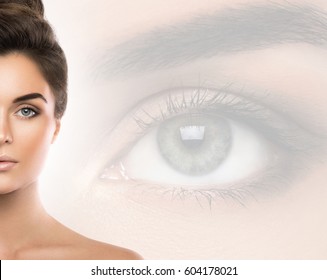 Beautiful woman and eye on background