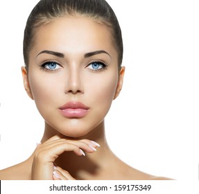 Beautiful Woman Face. Beauty Portrait. Beautiful Spa Woman Touching Her Face. Perfect Fresh Skin. Pure Beauty Model Girl. Youth And Skin Care Concept. Brunette With Blue Eyes