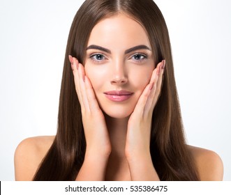 Beautiful woman face closeup portrait hands on skin - Shutterstock ID 535386475