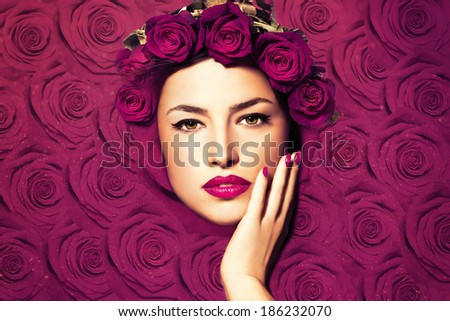 beautiful woman face framed with roses, flowers background