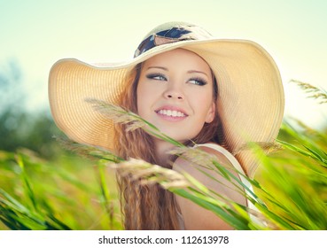 Beautiful Woman Face On Summer Meadow