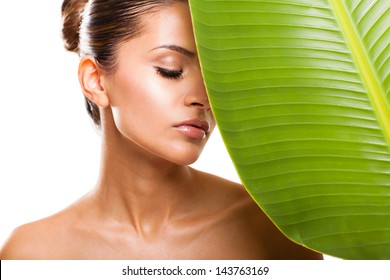 Beautiful Woman Face Portrait With Green Leaf And Closed Eyes