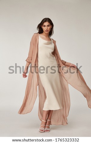 Beautiful woman fashion model makeup brunette hair perfect body shape tanned skin wear clothes summer collection organic silk dress and long shirt cape stylish sandals shoes, accessory romantic.
