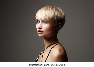 beautiful woman with fashion short haircut. Dyed blonde hair pretty girl