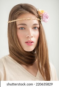 Beautiful Woman With Flower Headband Posing.