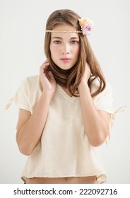 Beautiful Woman With Flower Headband Posing.