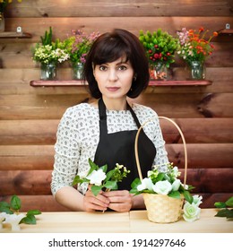 Beautiful Woman, Flower Shop Clerk Behind The Counter.