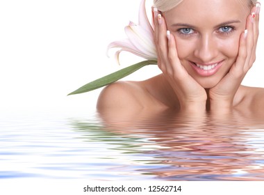 Beautiful woman with flower in water