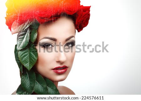 Beautiful woman with flowers and leafs in her hair. With a yellow and red helo. 