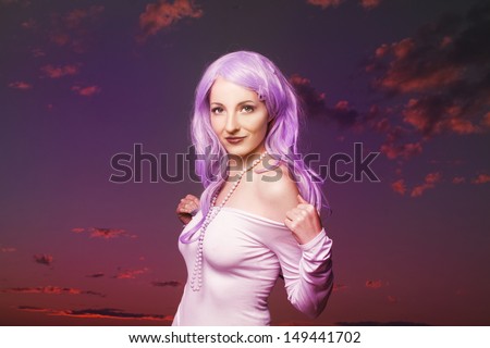 Beautiful woman in front of cloud background