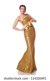 Beautiful Woman In Full Length Posing In Long Golden Party Dress, Over White Background