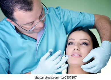Beautiful woman gets an injection in her face