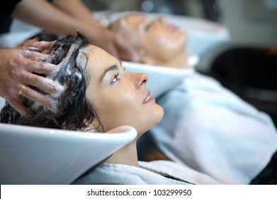 Beautiful Woman Getting A Hair Wash. In A Hair Salon