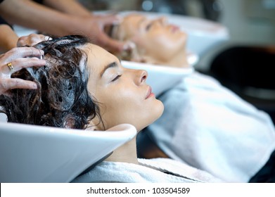Beautiful Woman Getting A Hair Wash. In A Hair Salon