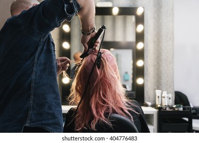 Beautiful woman getting haircut by hairdresser in the beauty salon. - Powered by Shutterstock