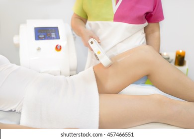 Beautiful Woman Getting Permanent Laser Hair Removal At Beauty Salon