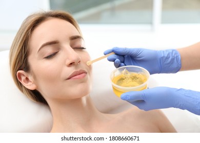 Beautiful Woman Getting Wax Epilation Of Face In Salon