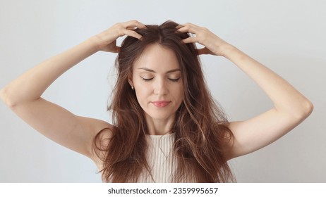 Beautiful woman gives head and hair massage to improve blood circulation, hair growth