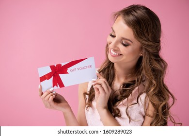 Beautiful Woman Giving A Gift Voucher 