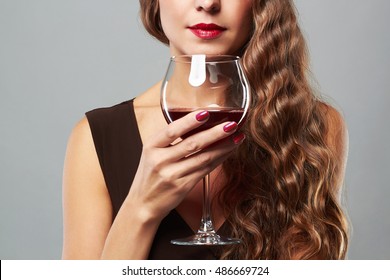 Beautiful Woman With Glass Red Wine. Curly Hairstyle