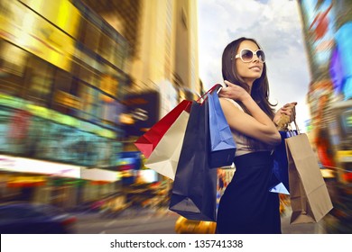 Beautiful Woman Goes Shopping In The City
