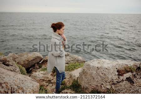 Similar – Senior sportswoman looking at the sea