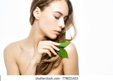 Beautiful woman with green leaves
