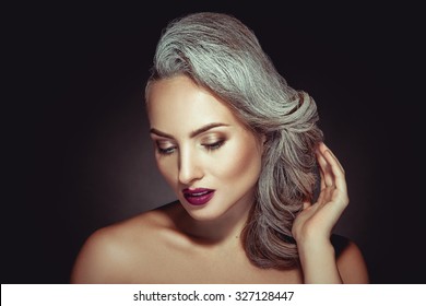 Beautiful Woman With Grey Hair Color And Nice Makeup In Studio