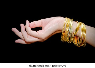 Beautiful woman hand hold gold bracelet jewelry, accessory and fashion. - Powered by Shutterstock