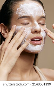 beautiful woman hand near face cream rejuvenation charm beige background - Shutterstock ID 2148501139