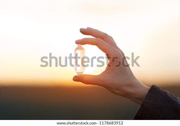 beautiful hands holding crystals gems