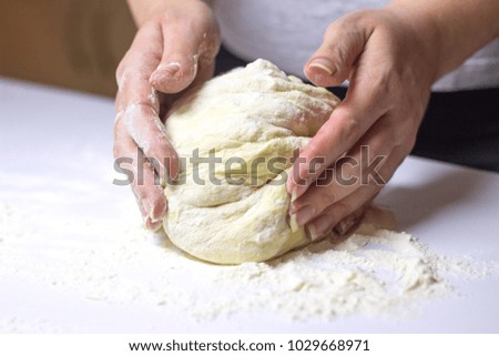 Similar – woman kneading bread dough with her hands